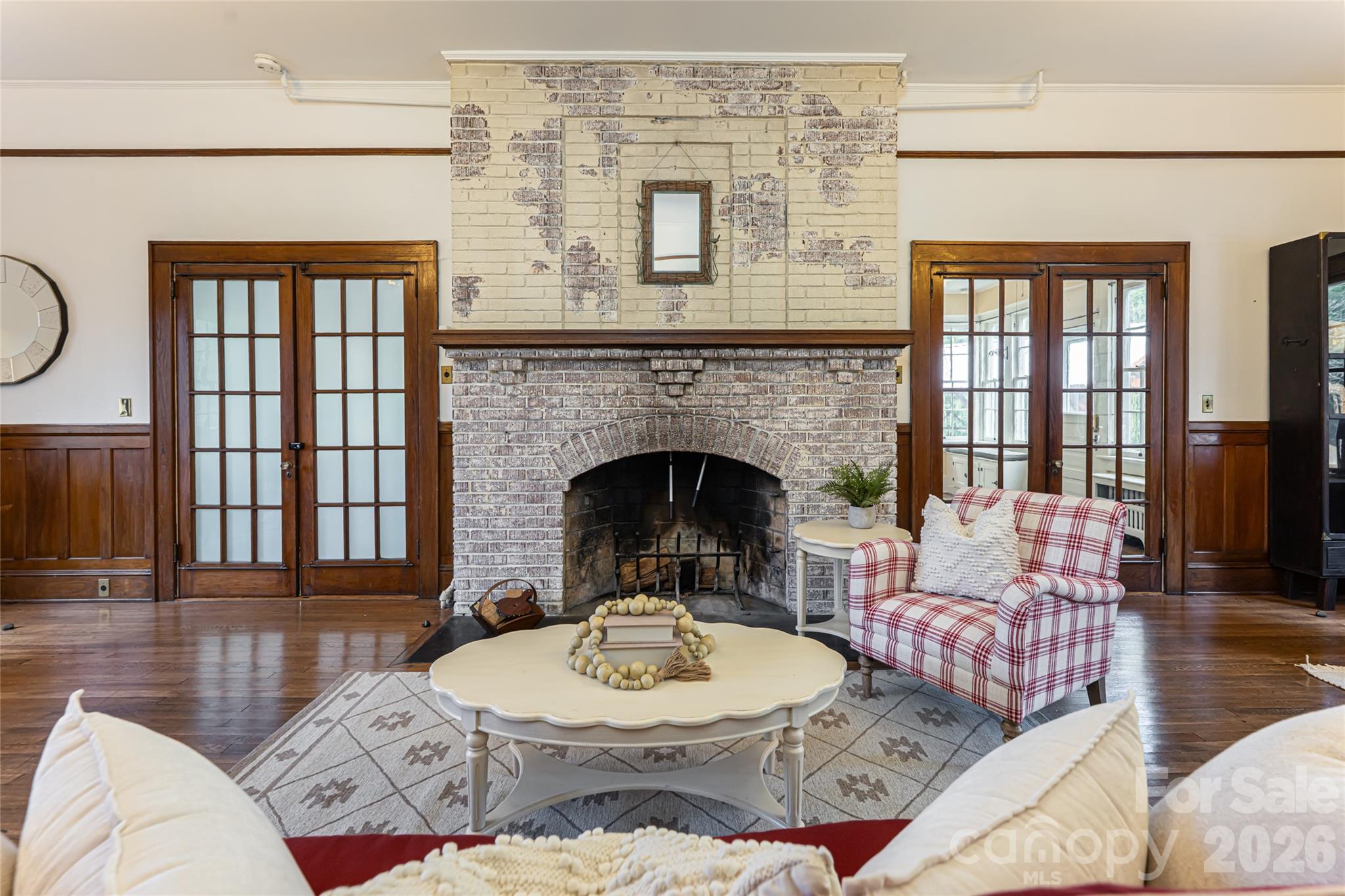147 Preservation Way Waynesville, NC 28786 - Photo 6 of 48 a living room with furniture a fireplace and a floor to ceiling window
