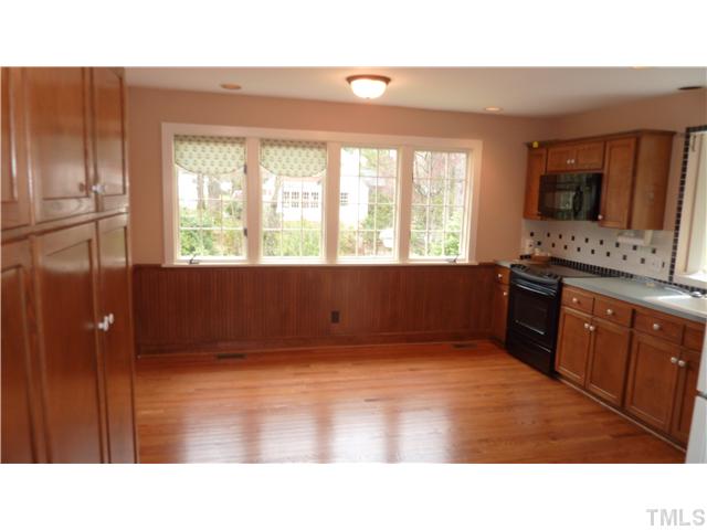 2730 Van Dyke Avenue Raleigh, NC 27607 - Photo 3 of 5 a kitchen with a refrigerator and a sink