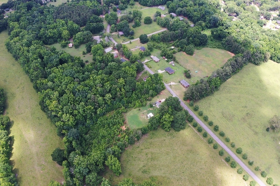 0 Cherokee Road Belton, SC 29627 - Photo 2 of 3 An aerial perspective reveals a verdant landscape with scattered homes and winding roads.