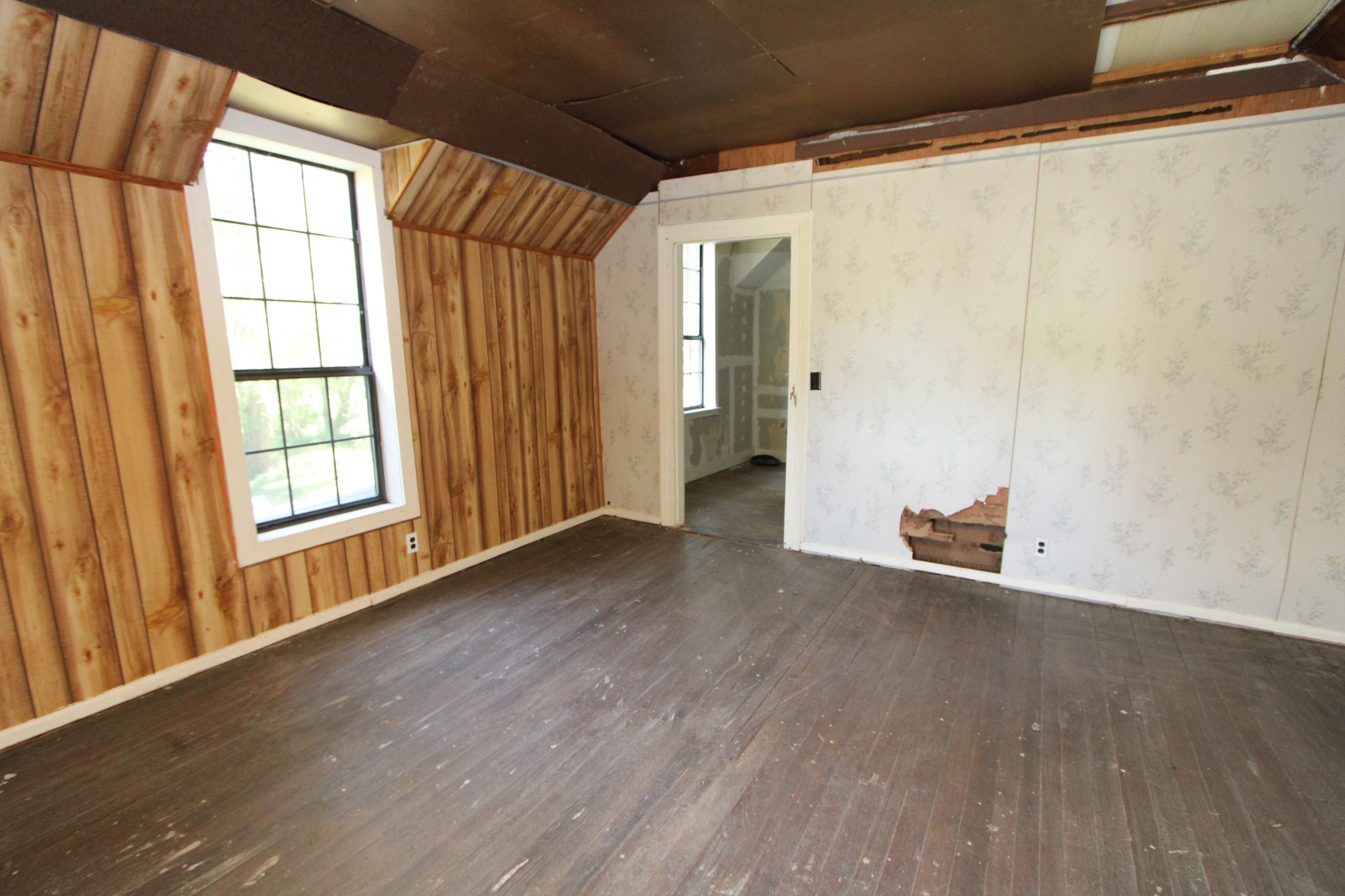 3182 Dodson Gap Road Culleoka, TN 38451 - Photo 13 of 15 a view of an empty room with wooden floor and a window