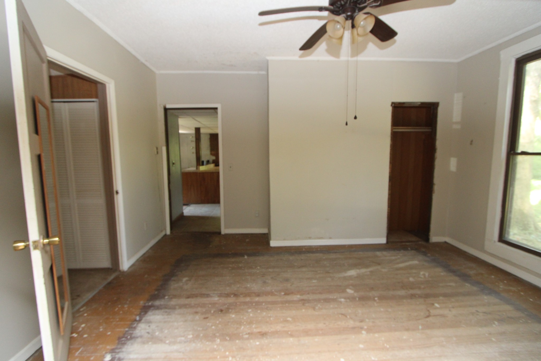3182 Dodson Gap Road Culleoka, TN 38451 - Photo 3 of 15 a view of a livingroom with a ceiling fan and window