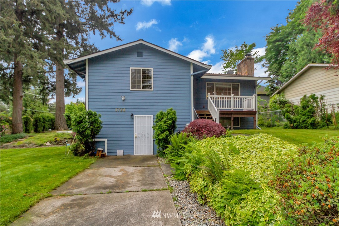 3726 199th Street Southeast Bothell, WA 98012 - Photo 1 of 18 a front view of a house with a yard