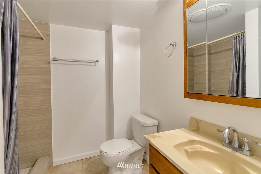 3726 199th Street Southeast Bothell, WA 98012 - Photo 13 of 18 a bathroom with a sink toilet and vanity