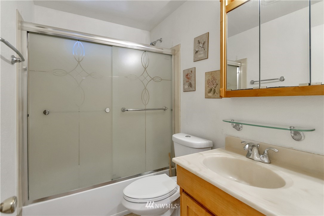 3726 199th Street Southeast Bothell, WA 98012 - Photo 4 of 18 a bathroom with a sink toilet and shower