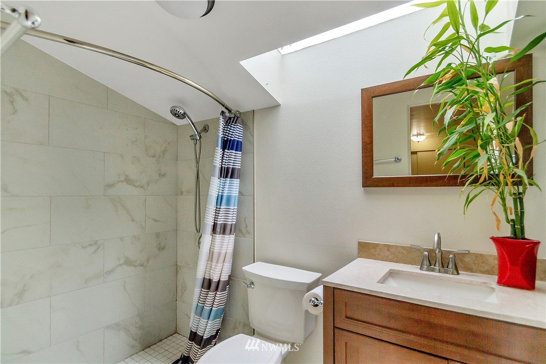 3726 199th Street Southeast Bothell, WA 98012 - Photo 5 of 18 a bathroom with a granite countertop sink toilet and shower
