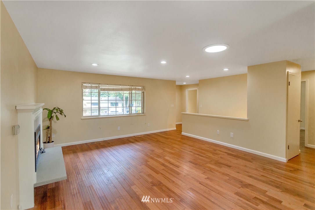 3726 199th Street Southeast Bothell, WA 98012 - Photo 8 of 18 wooden floor in an empty room with a window