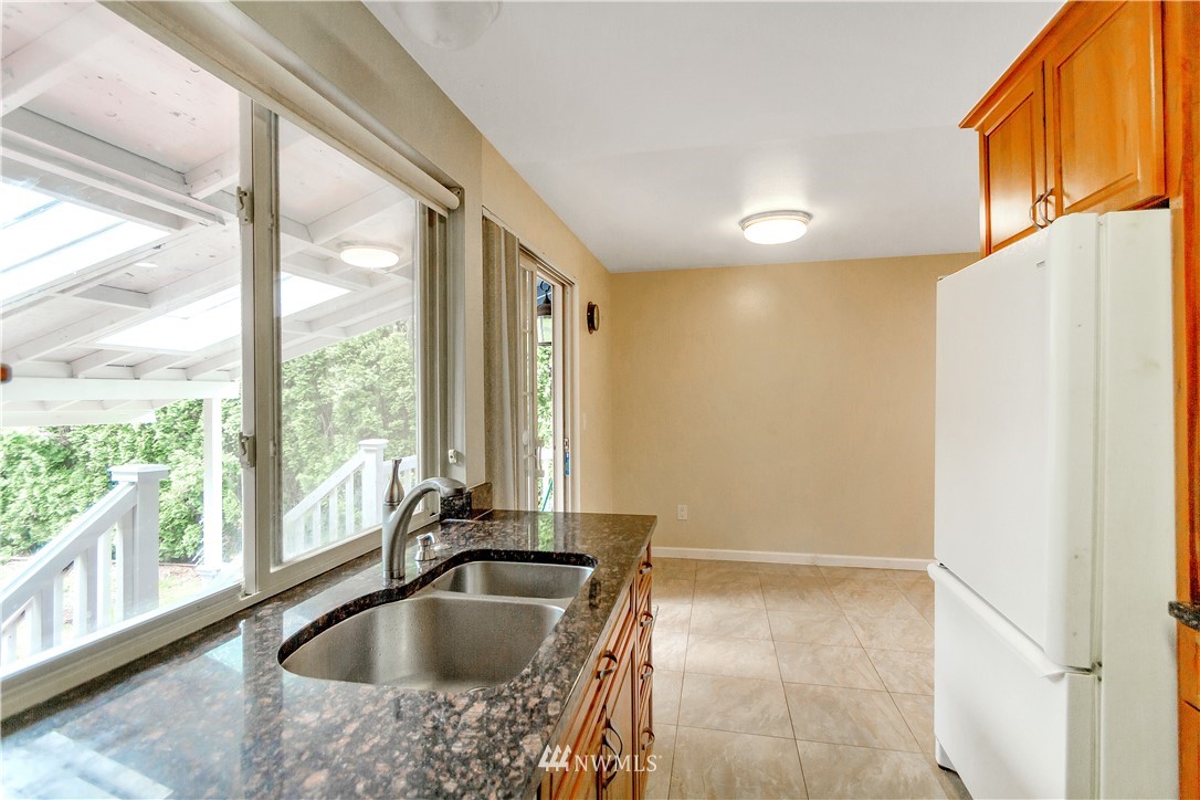 3726 199th Street Southeast Bothell, WA 98012 - Photo 10 of 18 a view of kitchen sink a refrigerator and window
