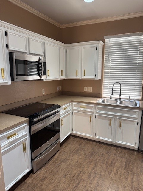 6815 Independence Boulevard Baytown, TX 77521 - Photo 9 of 24 a kitchen with granite countertop white cabinets white stainless steel appliances and sink