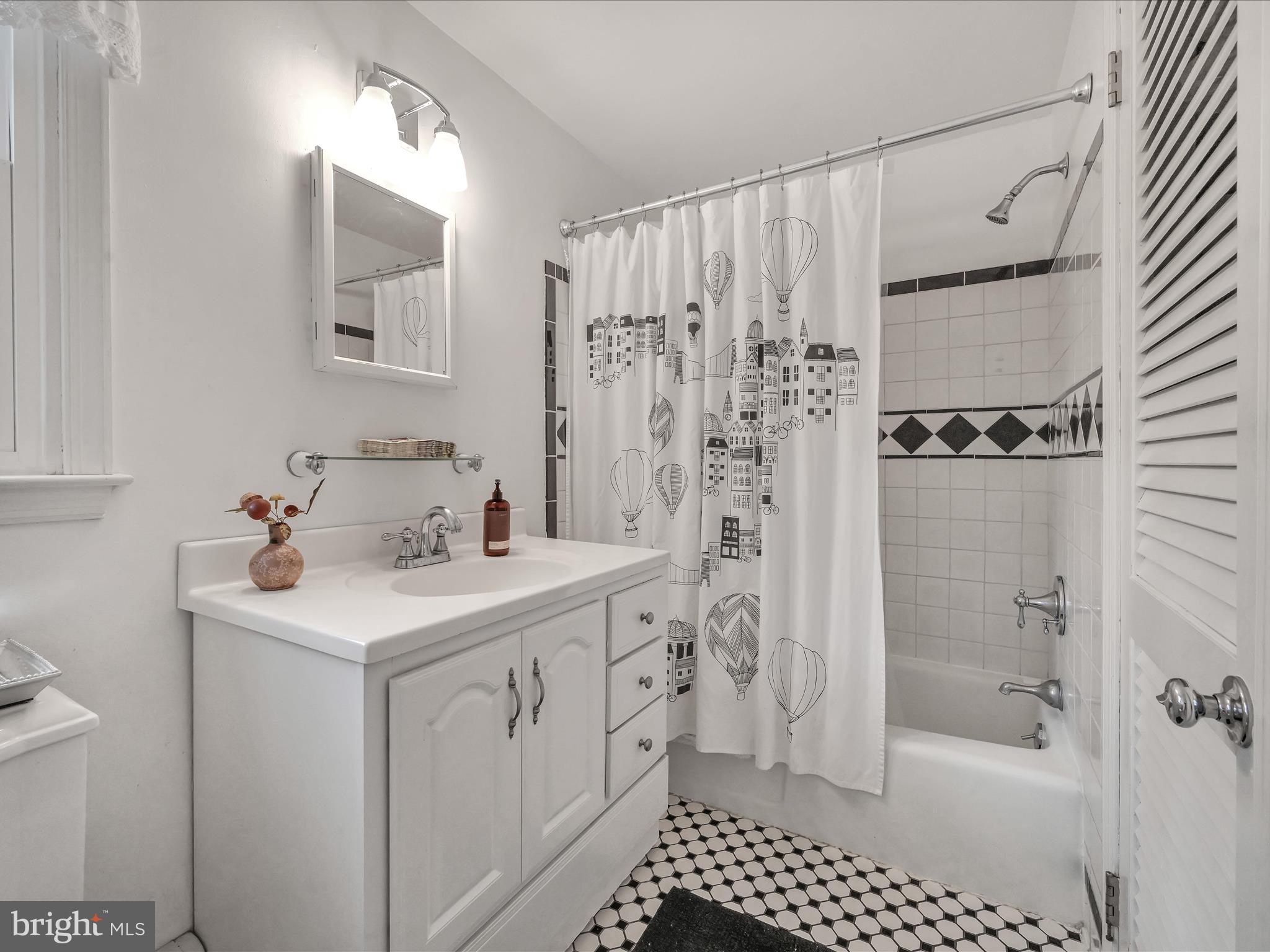 2 Cold Spring Road Media, PA 19063 - Photo 40 of 55 Tasteful Black & White Tile & Vanity with Storage