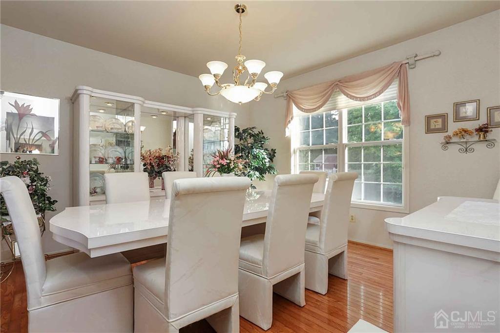 50 Stratton Road Old Bridge, NJ 07747 - Photo 4 of 15 a view of a dining room with furniture window and wooden floor