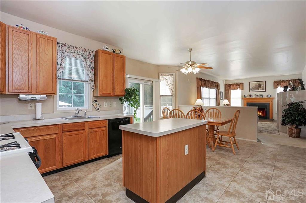 50 Stratton Road Old Bridge, NJ 07747 - Photo 5 of 15 a kitchen with stainless steel appliances granite countertop a sink and a stove