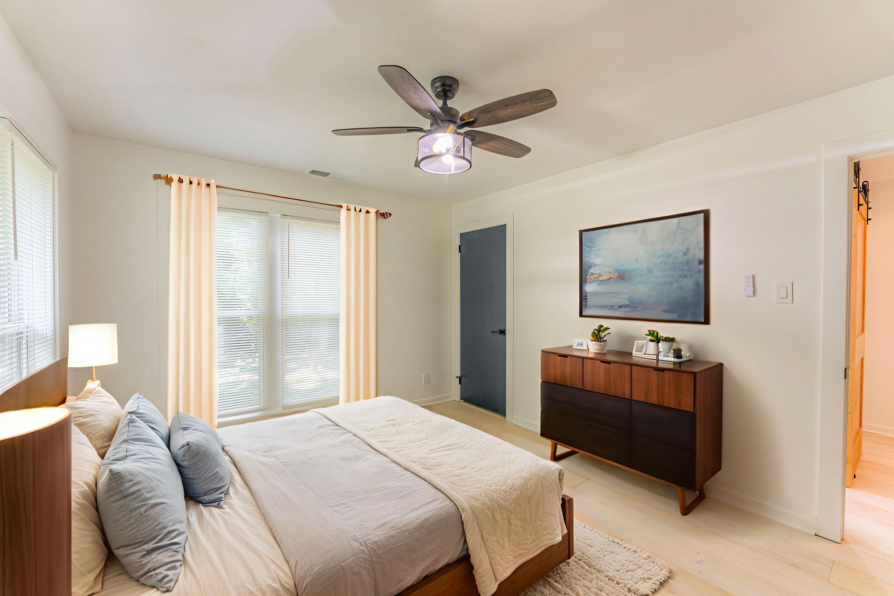 6224 Benjestown Road Memphis, TN 38127 - Photo 11 of 36 a bedroom with a bed and a chandelier