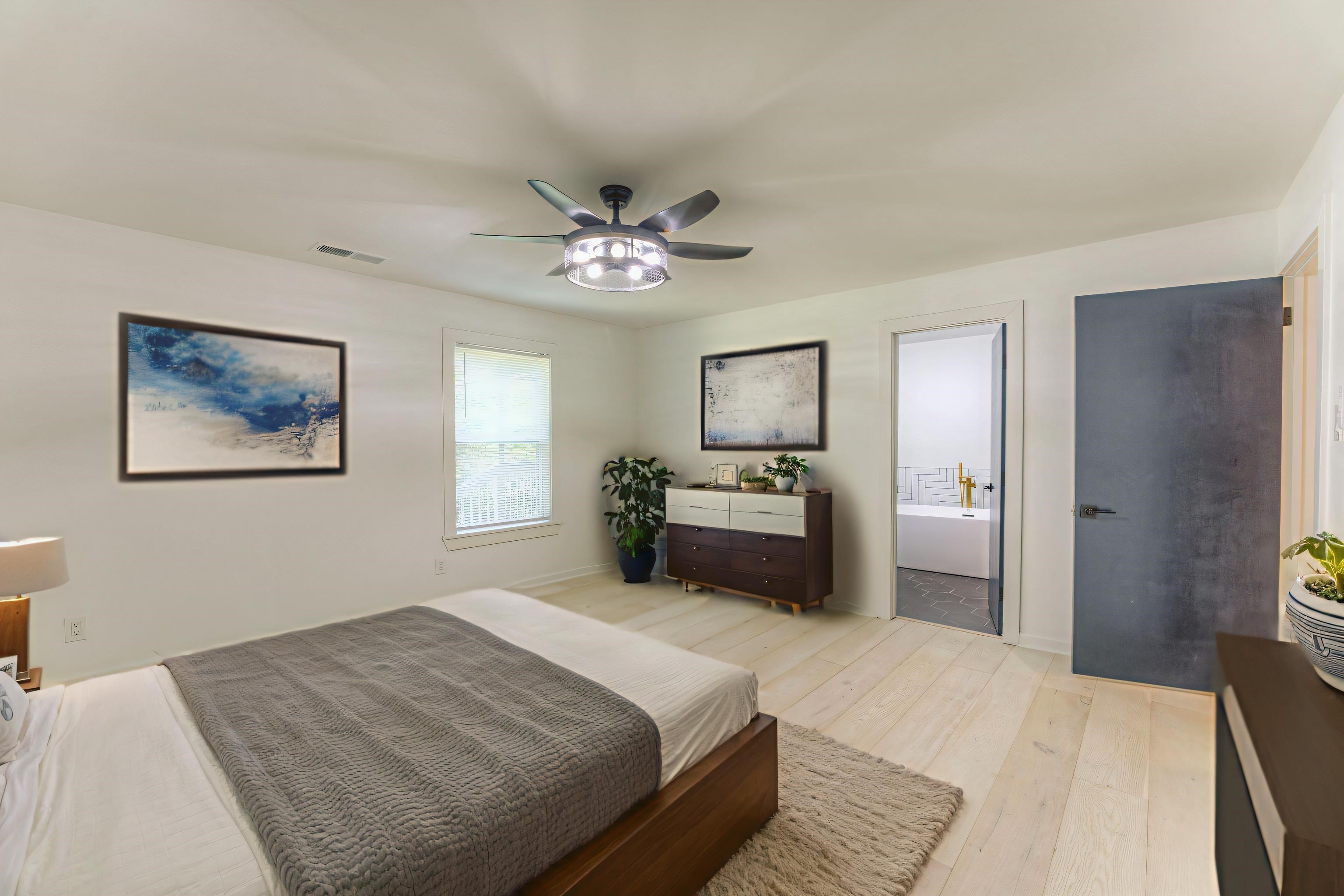 6224 Benjestown Road Memphis, TN 38127 - Photo 15 of 36 a bedroom with a bed and a chandelier