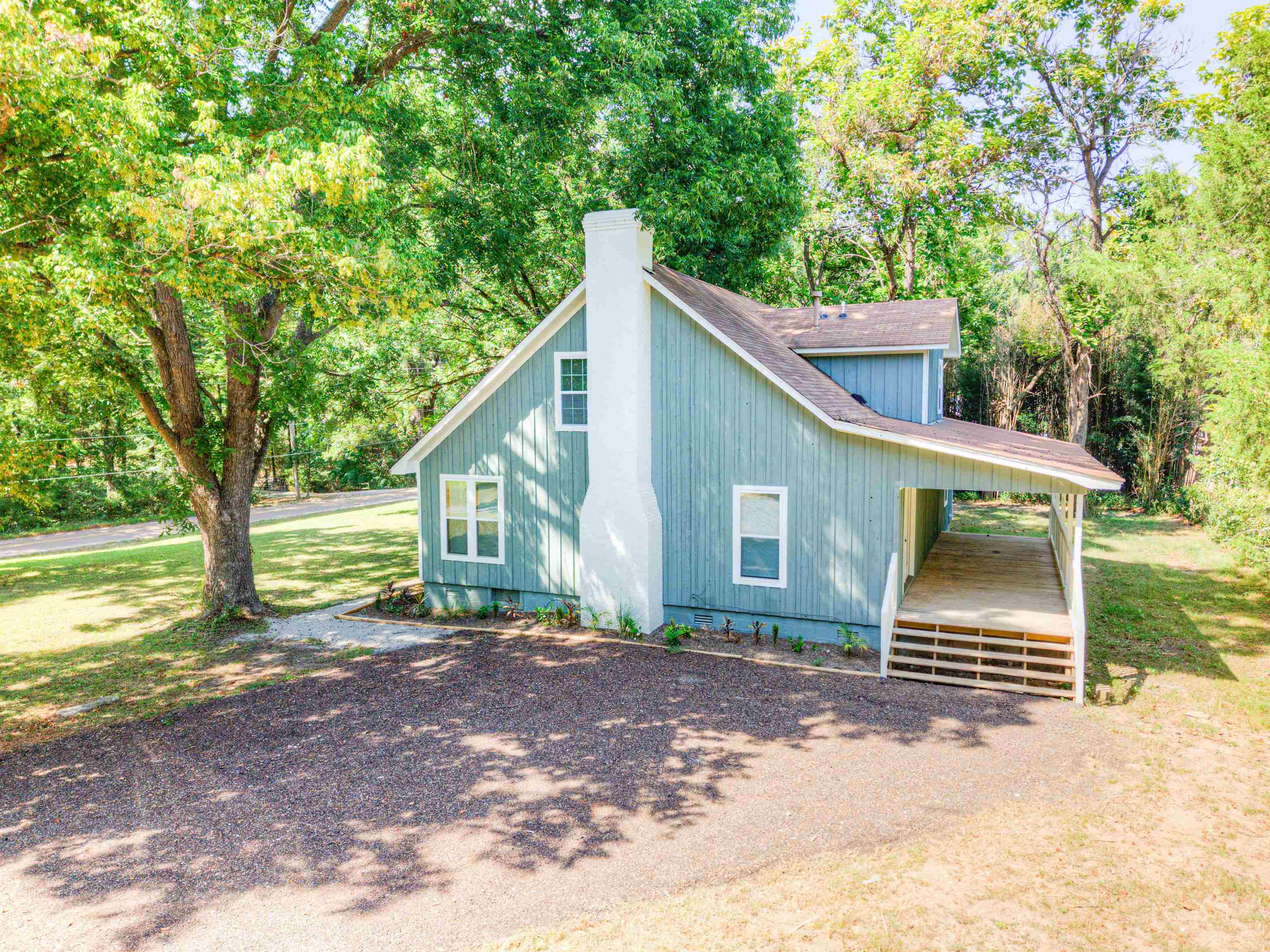 6224 Benjestown Road Memphis, TN 38127 - Photo 33 of 36 a front view of a house with a yard and trees