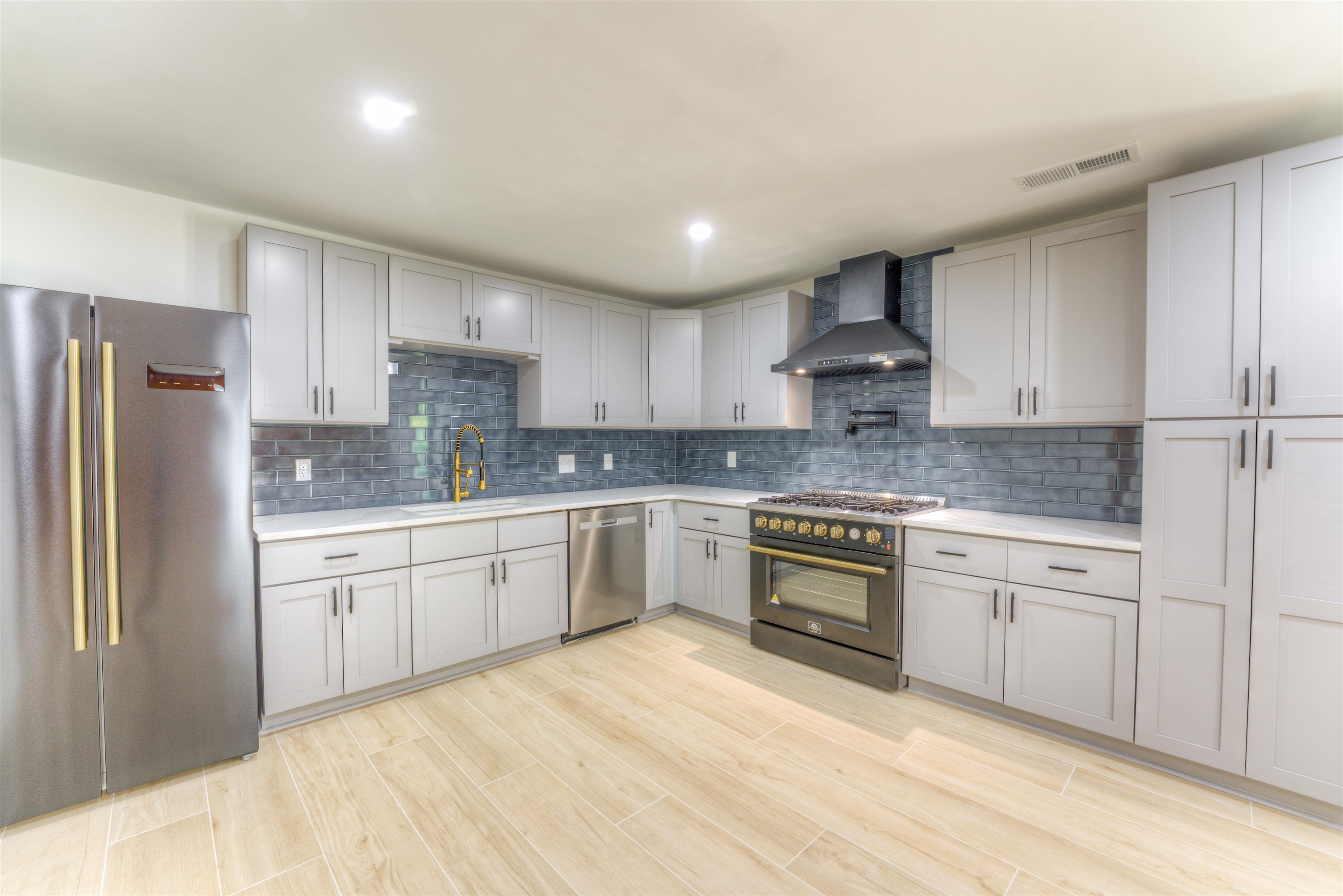 6224 Benjestown Road Memphis, TN 38127 - Photo 8 of 36 a kitchen with granite countertop a refrigerator stove top oven and sink