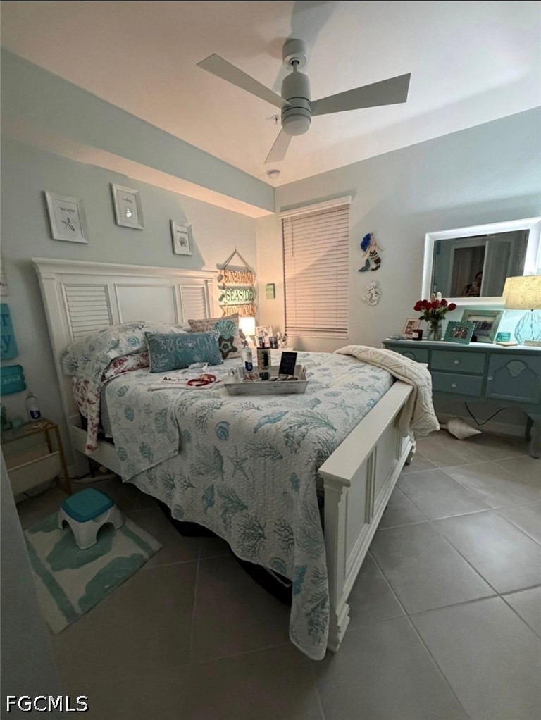 14191 Poppy Fld Loop, Unit 5312 Punta Gorda, FL 33955 - Photo 30 of 41 a bedroom with a bed and a table