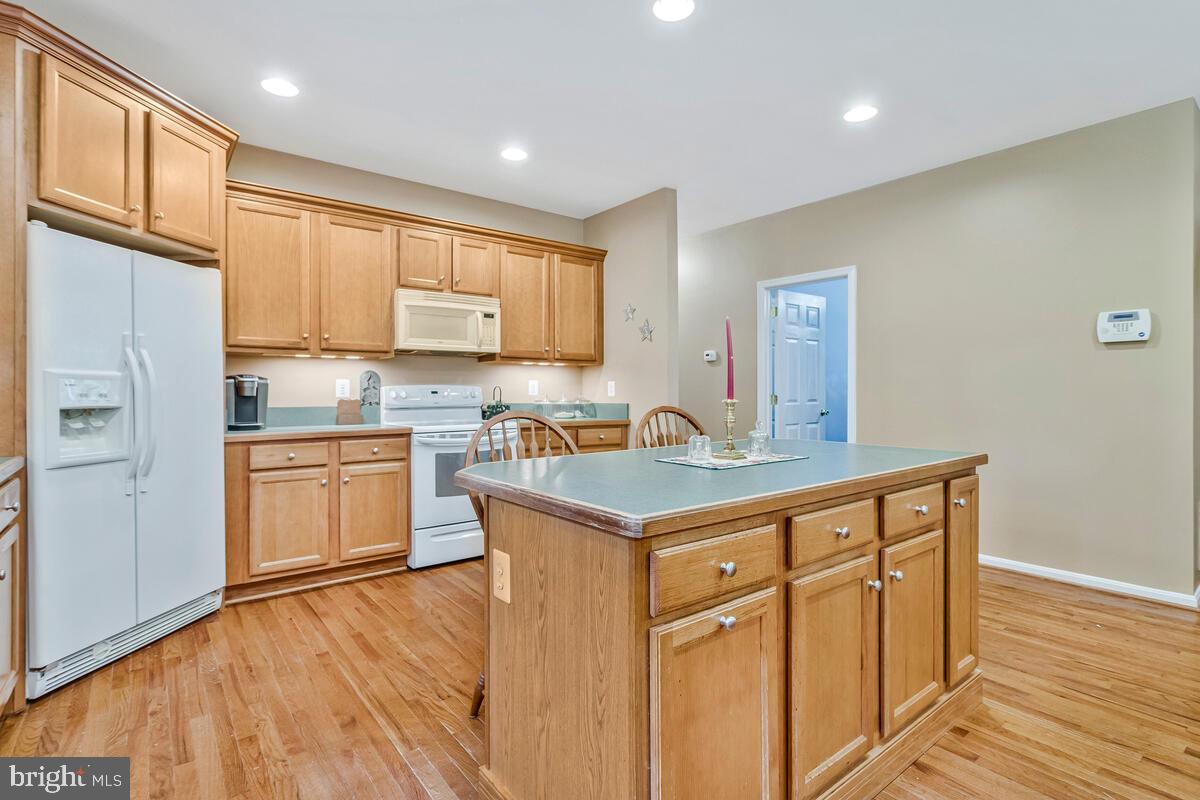 1955 Wilson Road Huntingtown, MD 20639 - Photo 11 of 45 a kitchen with stainless steel appliances granite countertop a sink stove and refrigerator