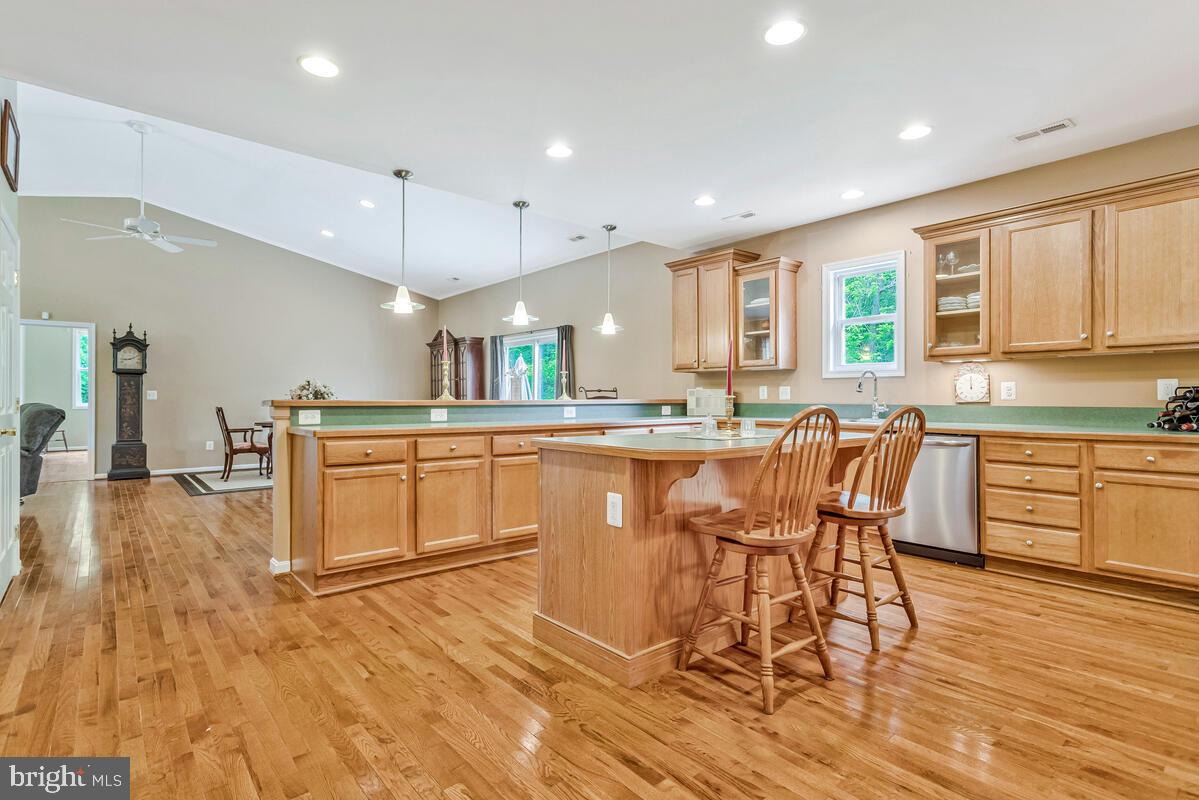 1955 Wilson Road Huntingtown, MD 20639 - Photo 16 of 45 a large kitchen with a table and chairs