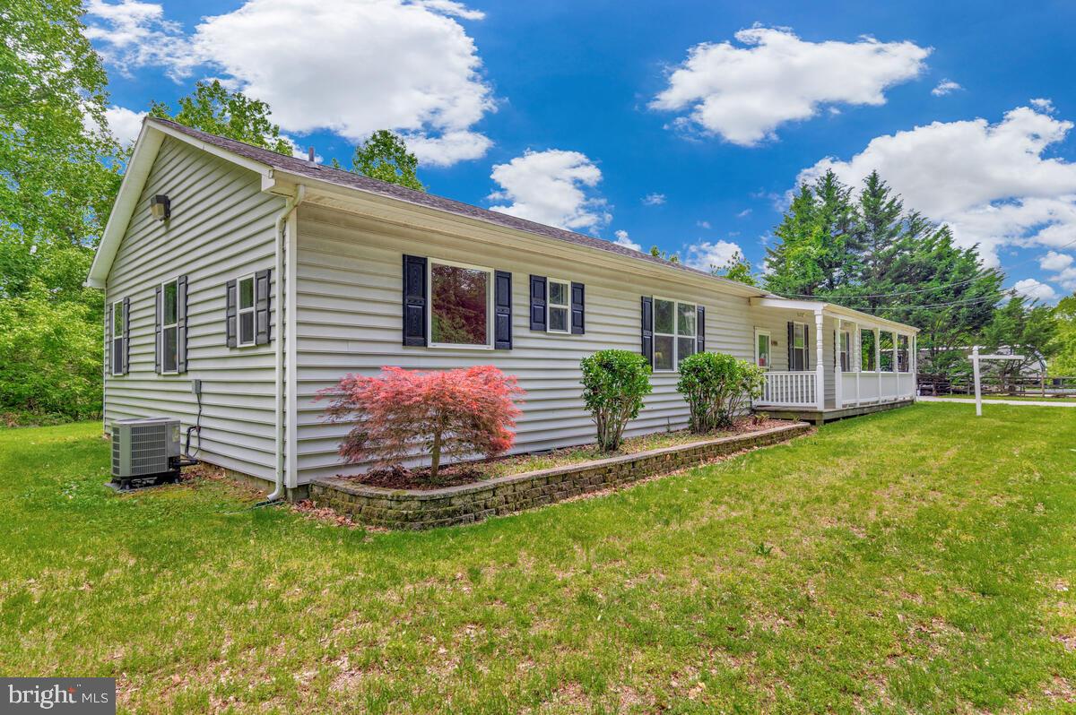 1955 Wilson Road Huntingtown, MD 20639 - Photo 2 of 45 a view of a house with a yard and front view of a house