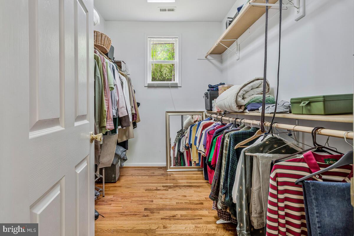 1955 Wilson Road Huntingtown, MD 20639 - Photo 22 of 45 a view of walk in closet with clothes and shoes