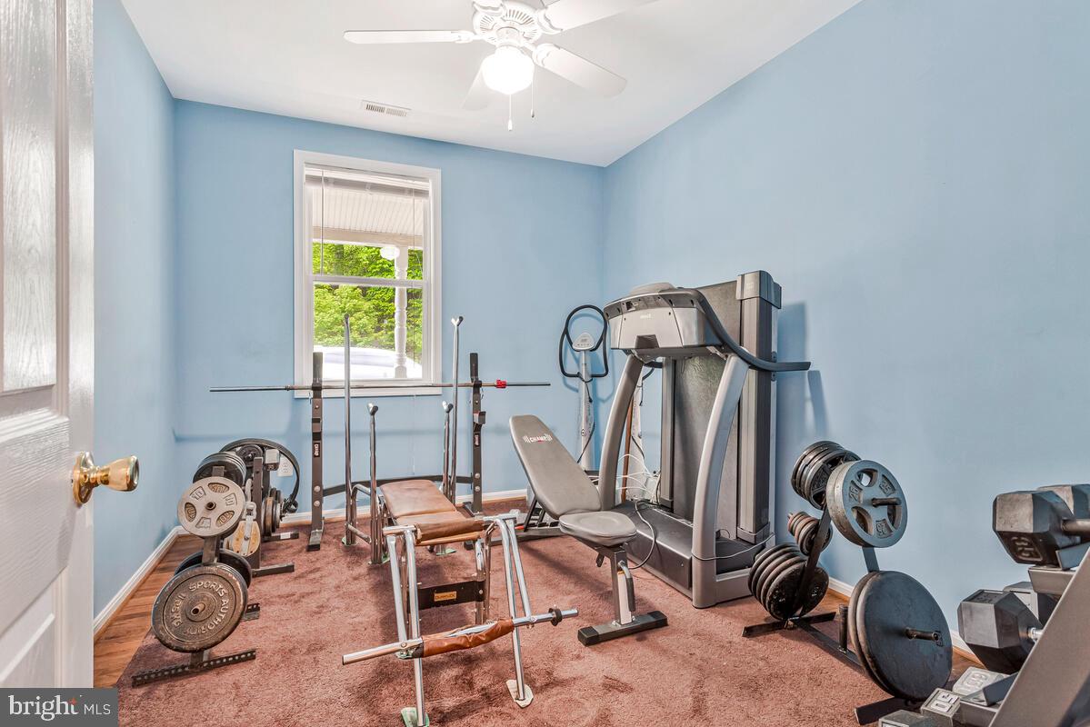 1955 Wilson Road Huntingtown, MD 20639 - Photo 25 of 45 a view of a room with gym equipment