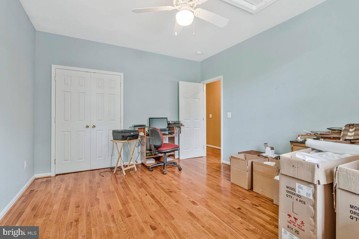 1955 Wilson Road Huntingtown, MD 20639 - Photo 28 of 45 a view of a workspace with furniture and a window