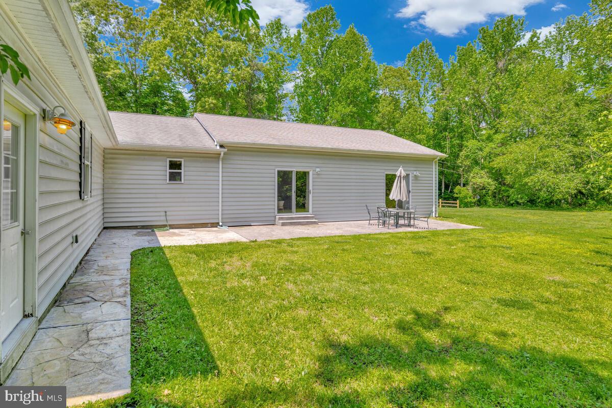 1955 Wilson Road Huntingtown, MD 20639 - Photo 36 of 45 a view of a white house with a yard