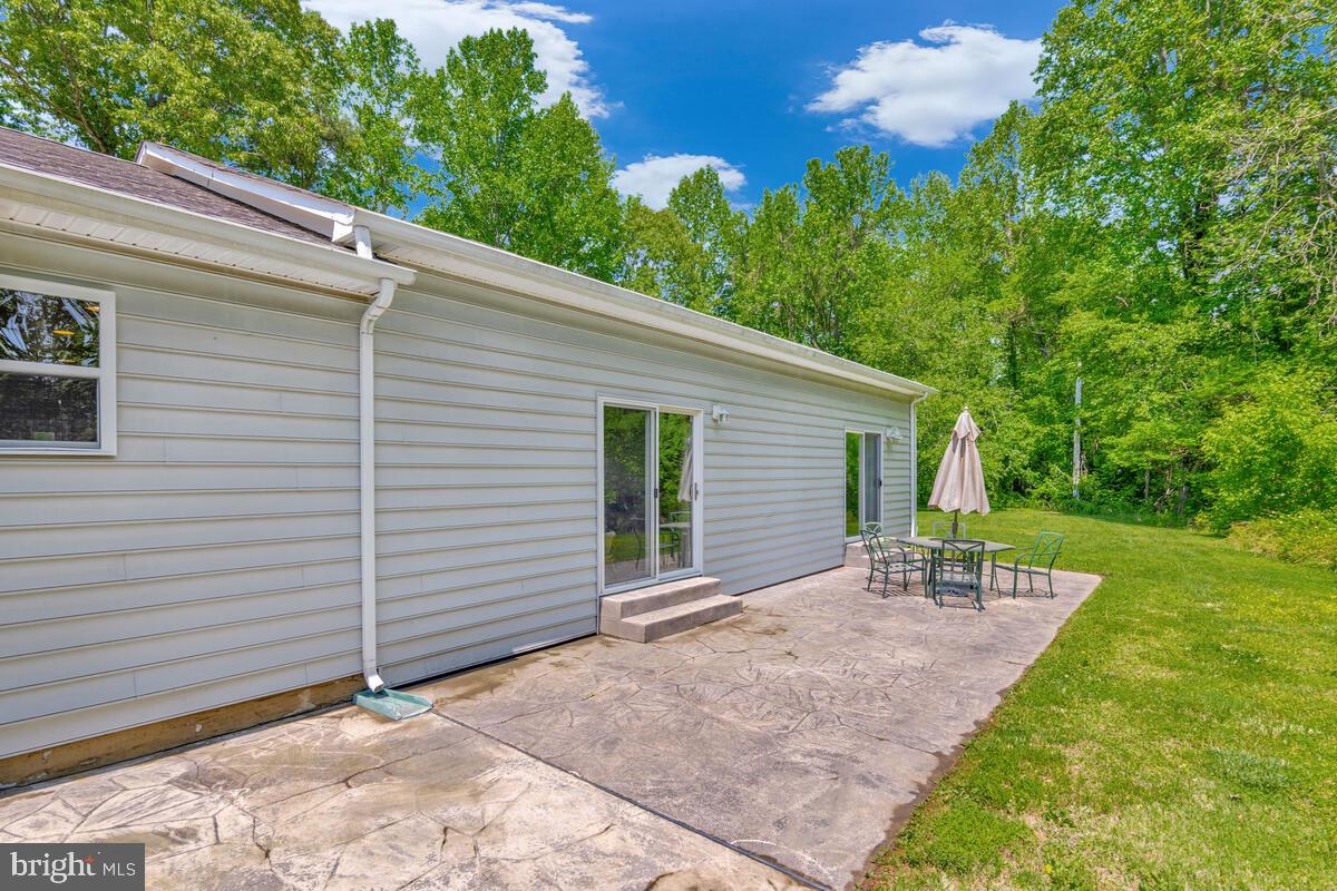 1955 Wilson Road Huntingtown, MD 20639 - Photo 37 of 45 a view of a house with yard and a garden