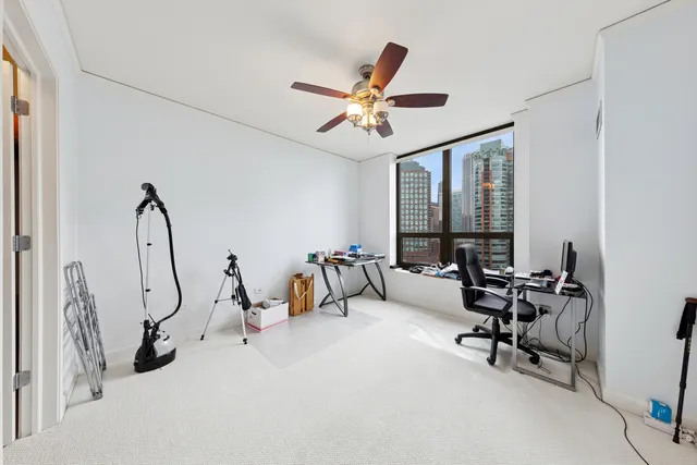 a room with gym equipment and a large window