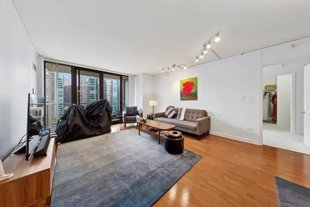 a living room with furniture gym equipment and a view of living room