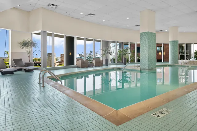 a view of a living room and floor to ceiling window or kitchen