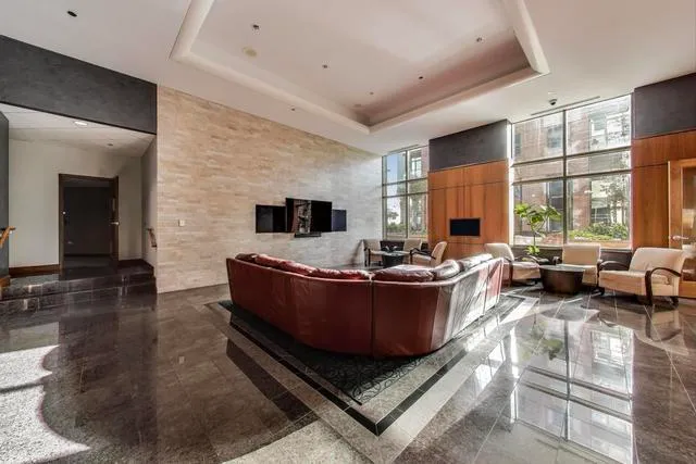 a living room with furniture and a large window