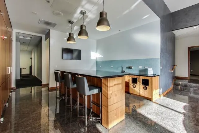a view of living room with furniture and chandelier