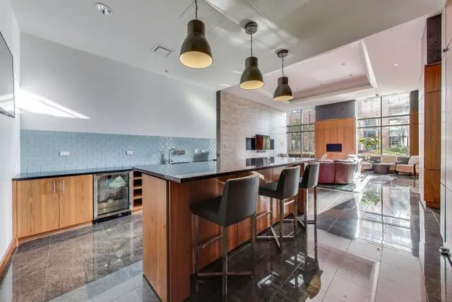 a open kitchen with a table and chairs in it