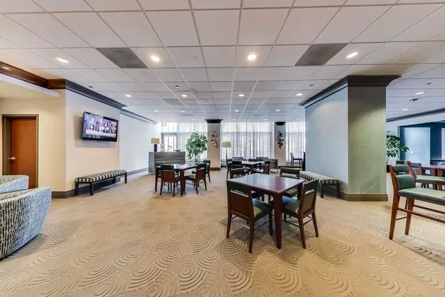 a view of a big room with furniture window and wooden floor