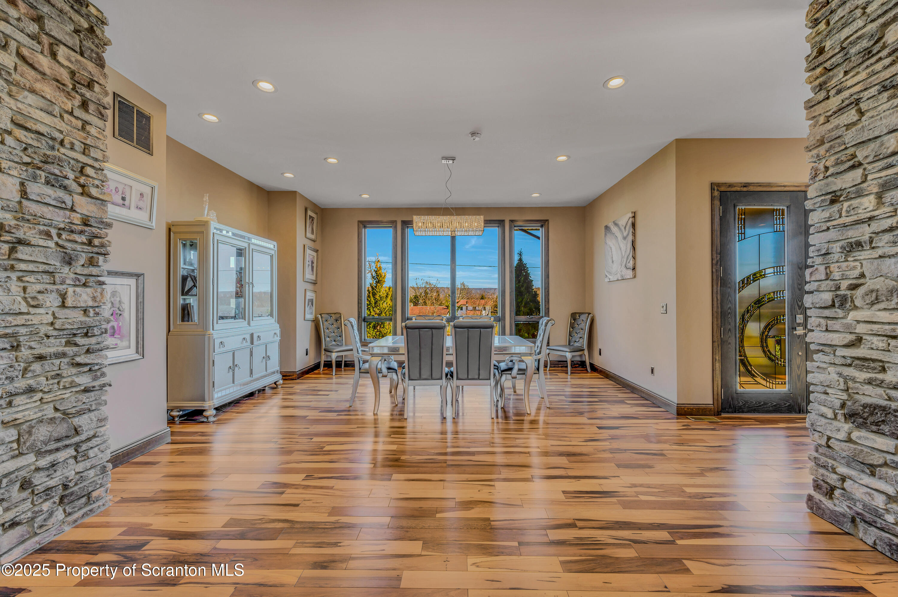 815 Oak Street Archbald, PA 18403 - Photo 21 of 85 a view of a livingroom with furniture an entryway and wooden floor
