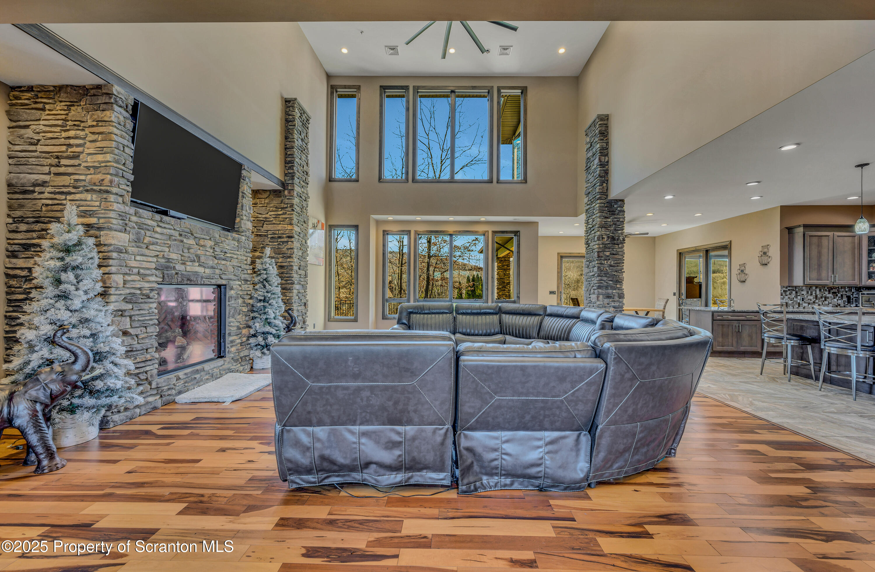 815 Oak Street Archbald, PA 18403 - Photo 29 of 85 a living room with fireplace furniture and a flat screen tv
