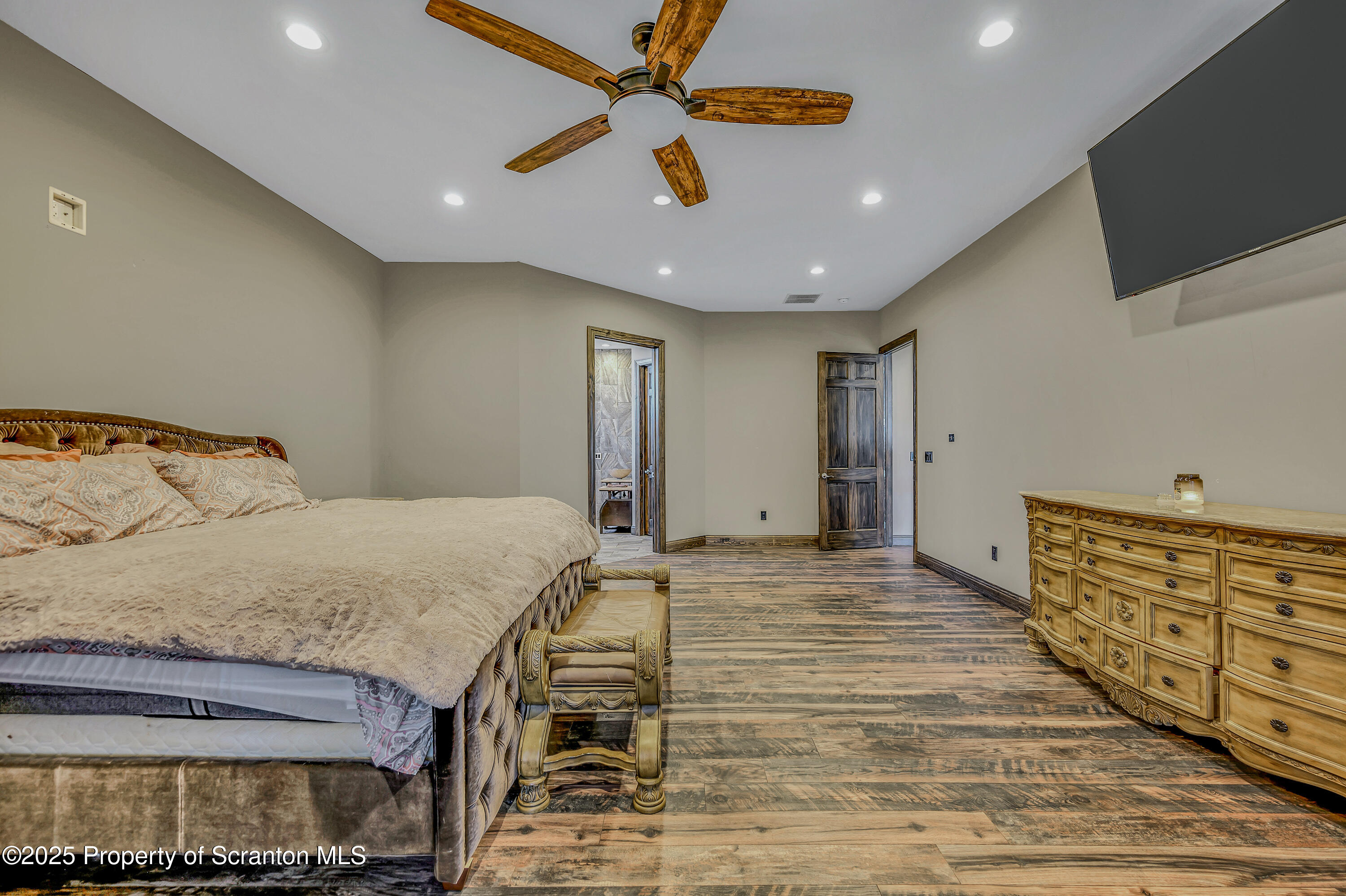 815 Oak Street Archbald, PA 18403 - Photo 35 of 85 a bedroom with a bed and a flat screen tv