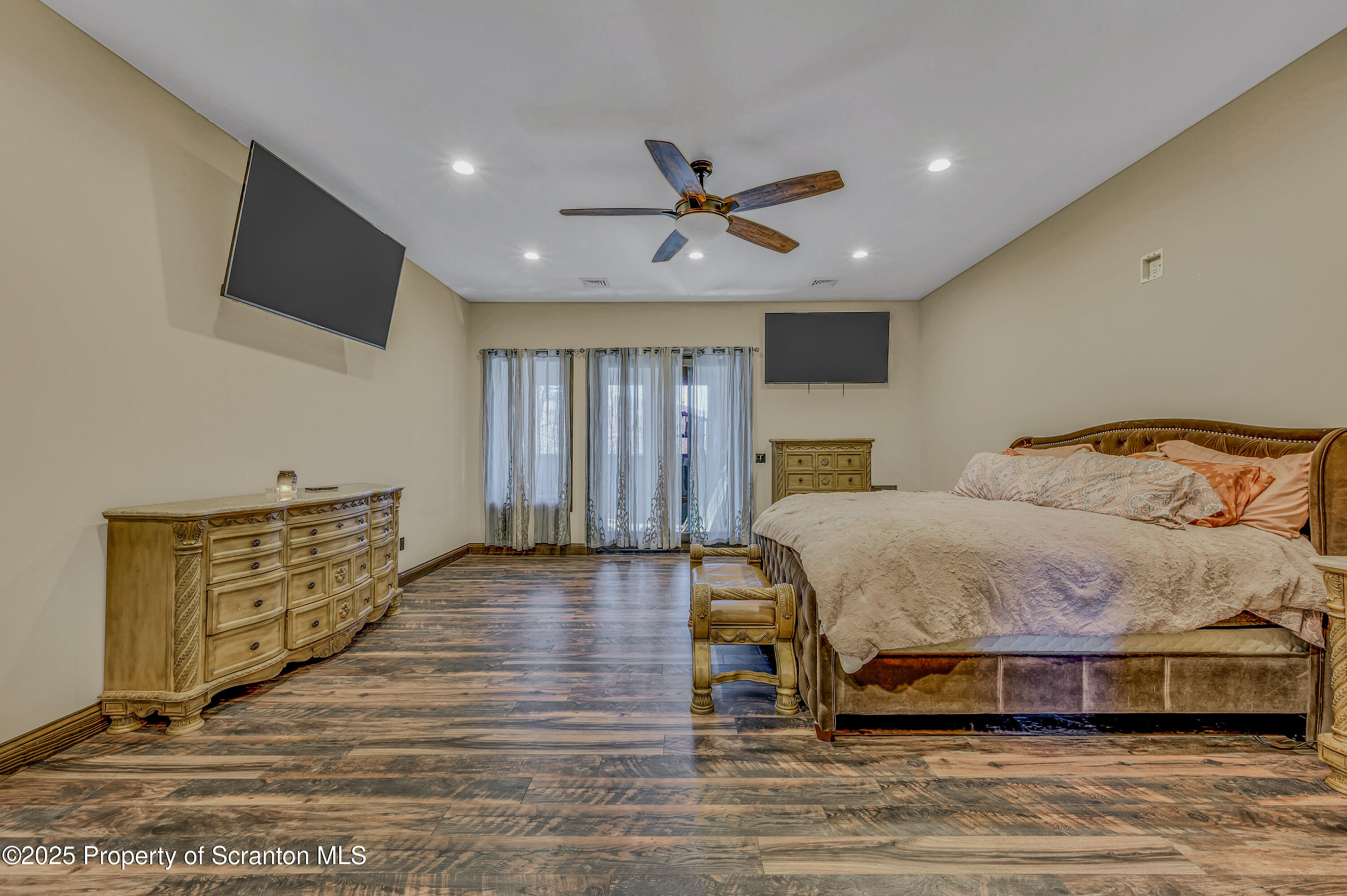 815 Oak Street Archbald, PA 18403 - Photo 36 of 85 a bedroom with a bed and wooden floor