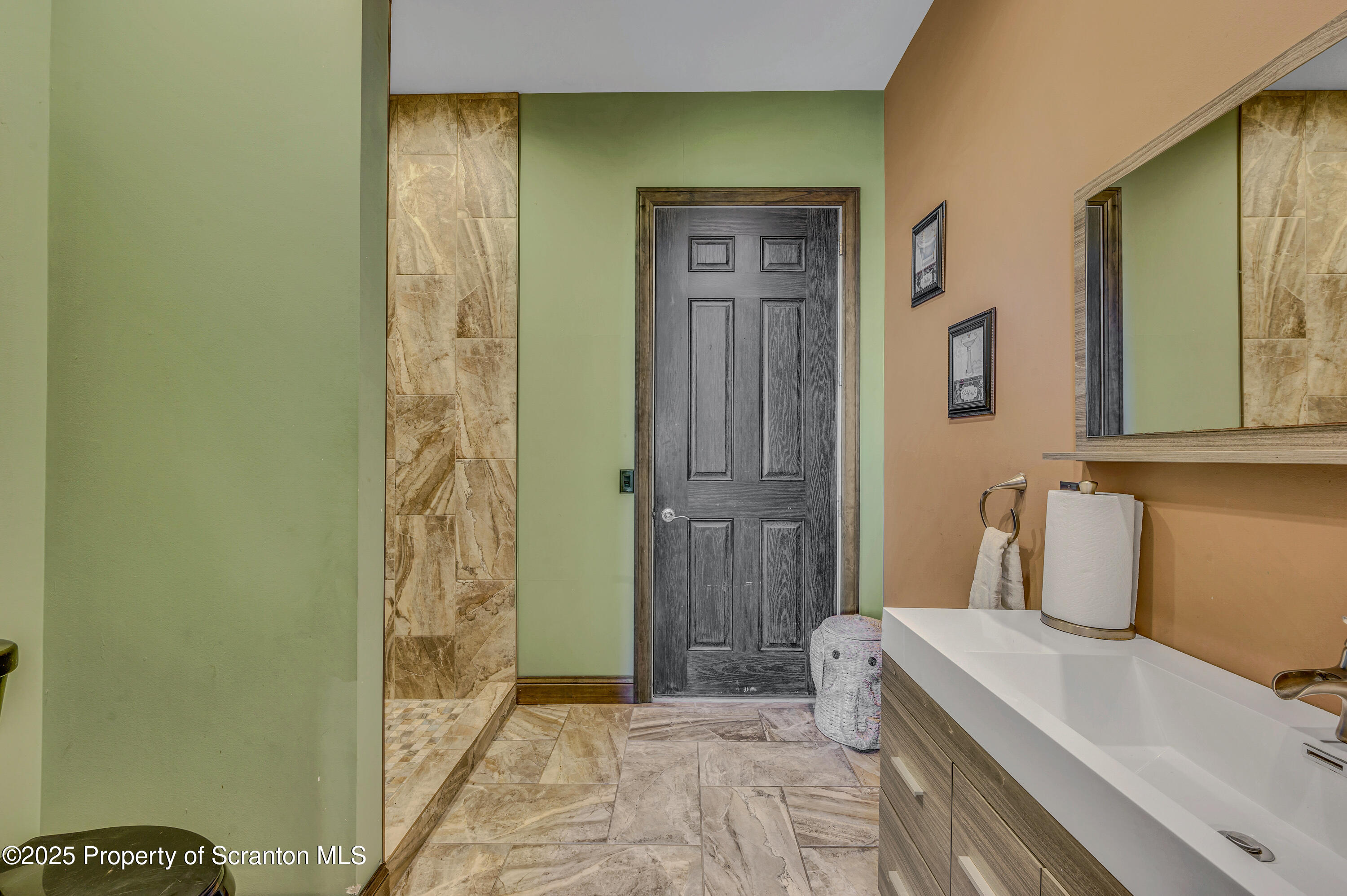 815 Oak Street Archbald, PA 18403 - Photo 50 of 85 a bathroom with a sink and a mirror