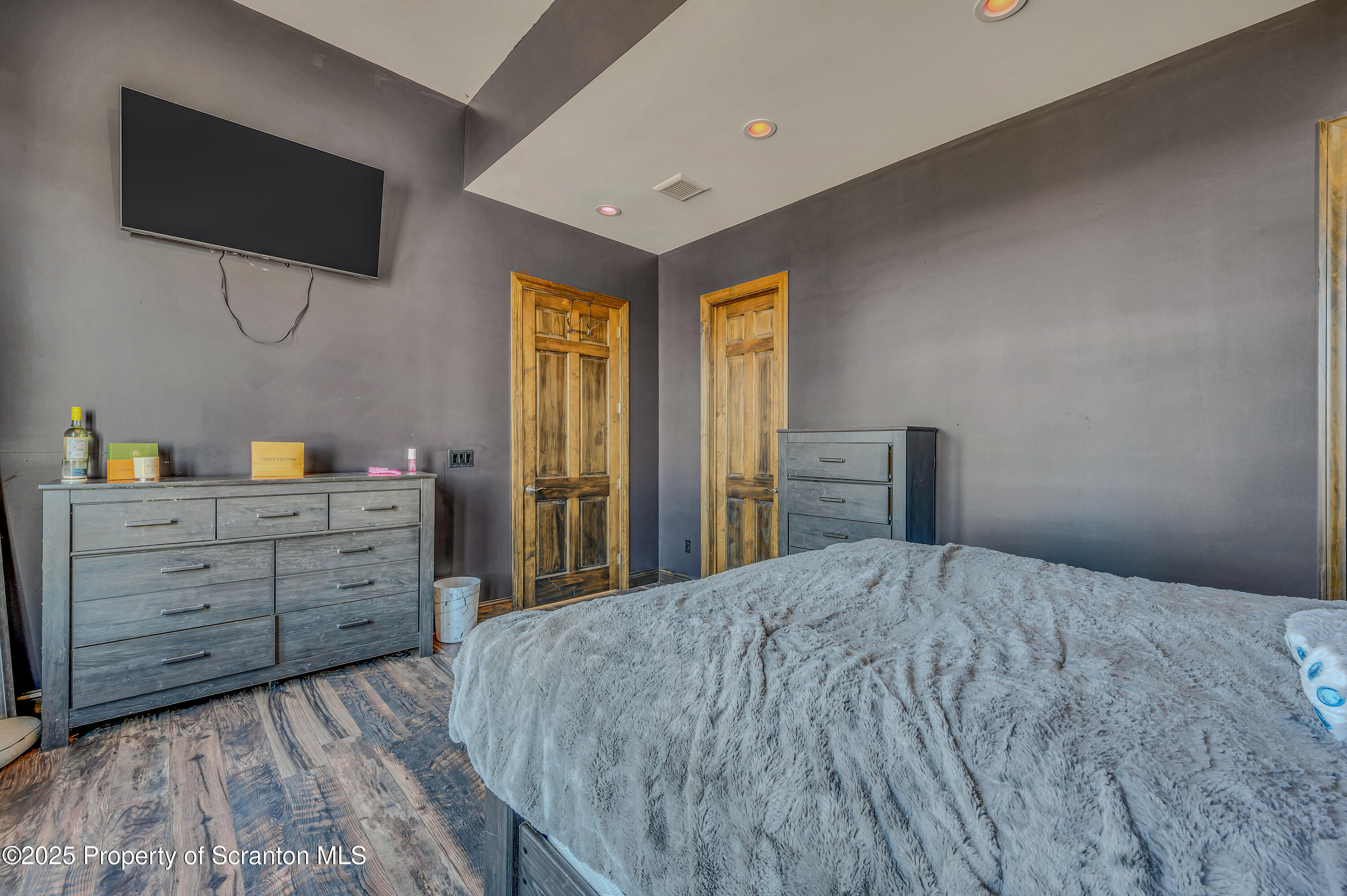 815 Oak Street Archbald, PA 18403 - Photo 65 of 85 a bedroom with a bed and a flat screen tv