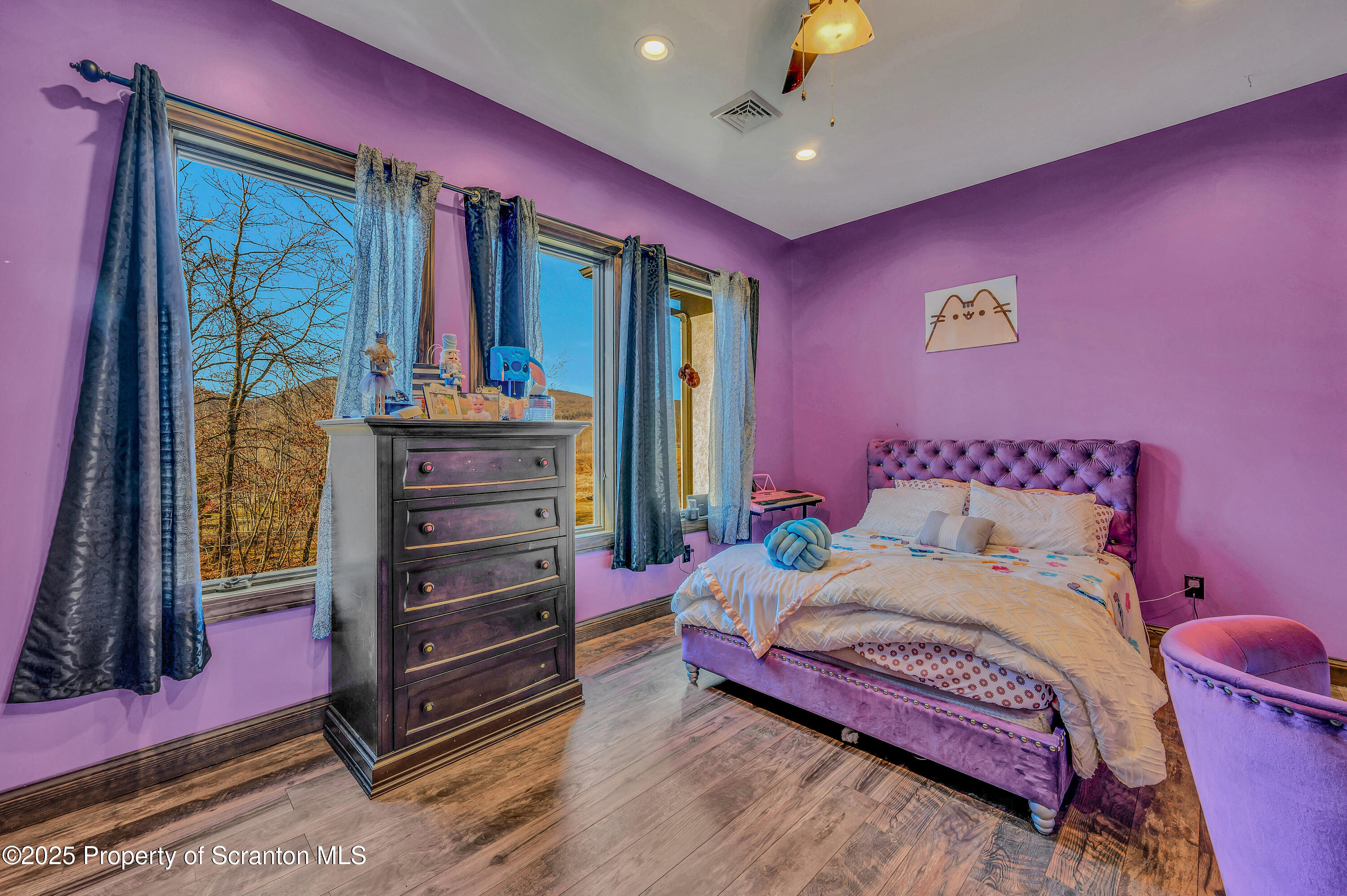 815 Oak Street Archbald, PA 18403 - Photo 69 of 85 a bedroom with a bed and a chandelier