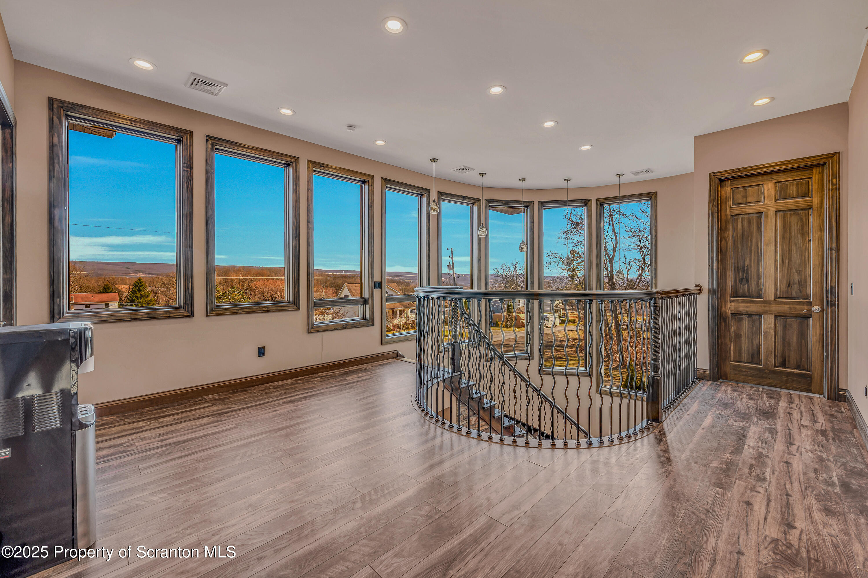 815 Oak Street Archbald, PA 18403 - Photo 77 of 85 a view of a hallway with wooden floor and fence