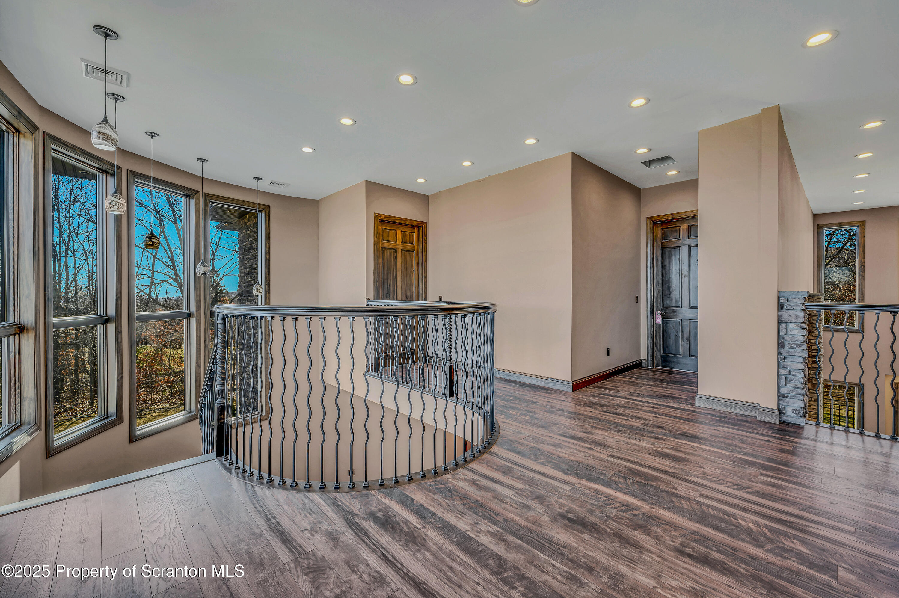 815 Oak Street Archbald, PA 18403 - Photo 78 of 85 a view of a hallway with wooden floor and windows