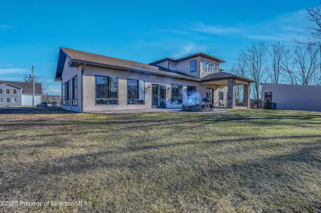 a kitchen with stainless steel appliances granite countertop a sink and a stove