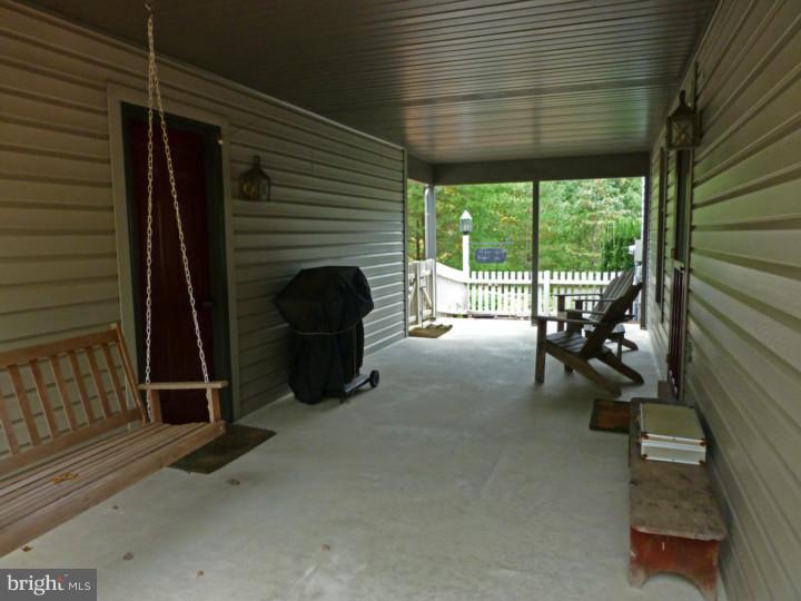 5067 Valley View Road Mohnton, PA 19540 - Photo 4 of 22 a view of a porch with furniture and a gate