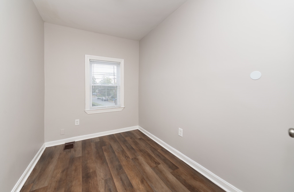 266-274 River Street Waltham, MA 02453 - Photo 20 of 27 a view of a room with wooden floor and windows