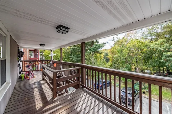 a view of a two chairs in the balcony