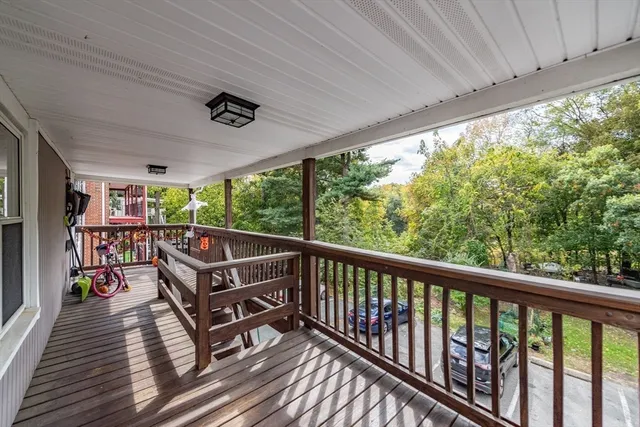 a view of a two chairs in the balcony