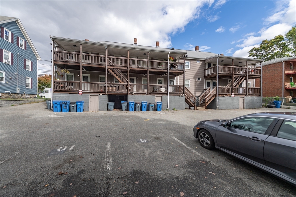 266-274 River Street Waltham, MA 02453 - Photo 25 of 27 a car parked in front of a house